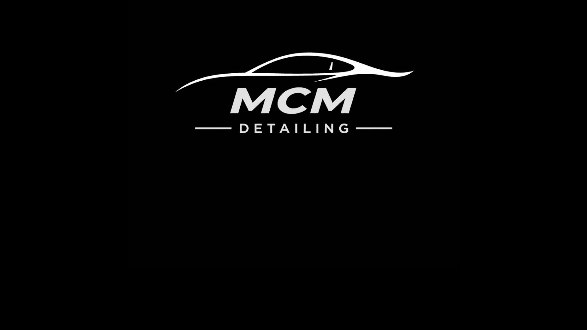 White MCM Detailing logo with a stylized car silhouette on a solid black background.